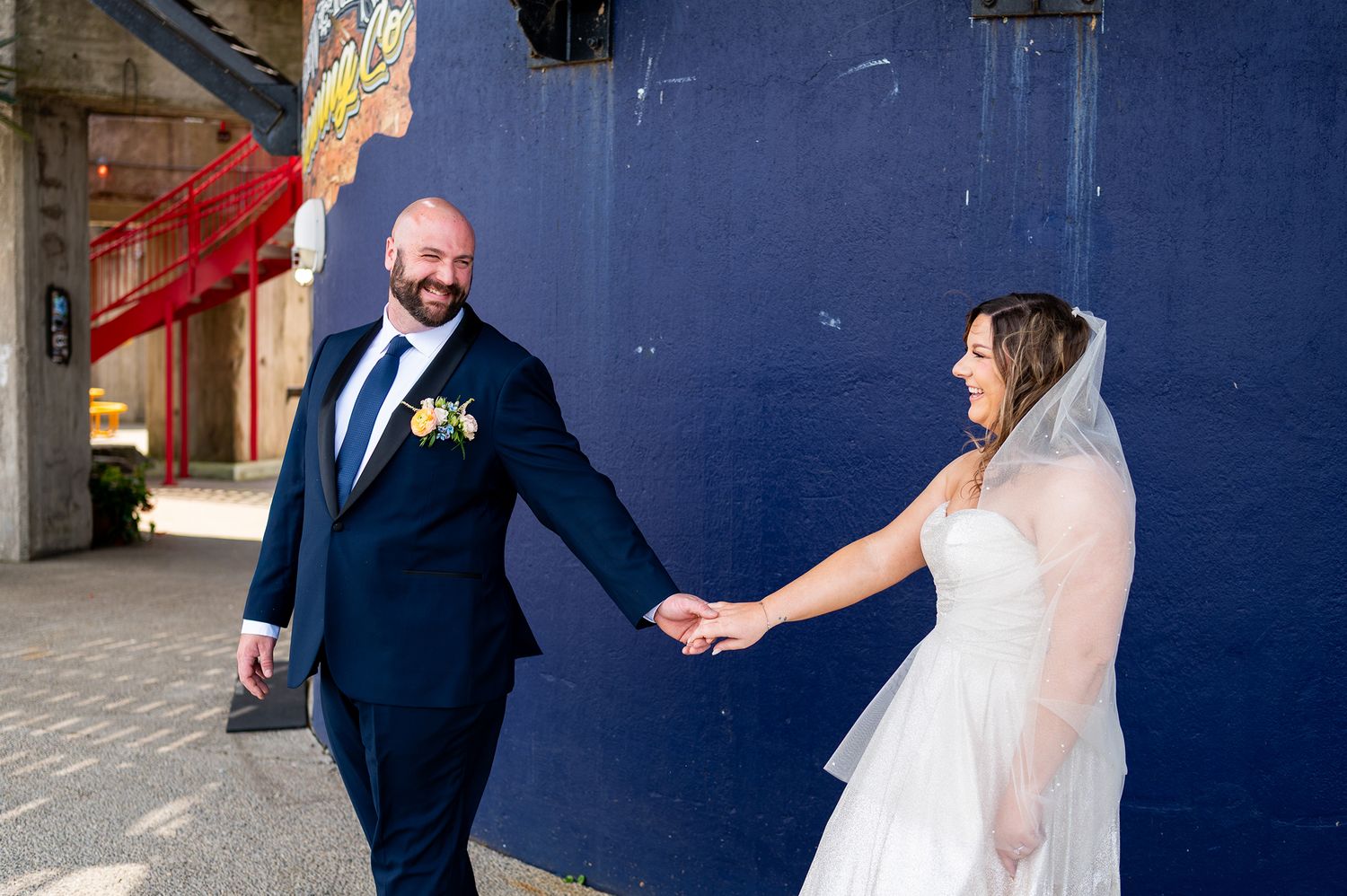 A sequence of wedding photos showing a couple in formal attire walking and posing together in an urban setting.