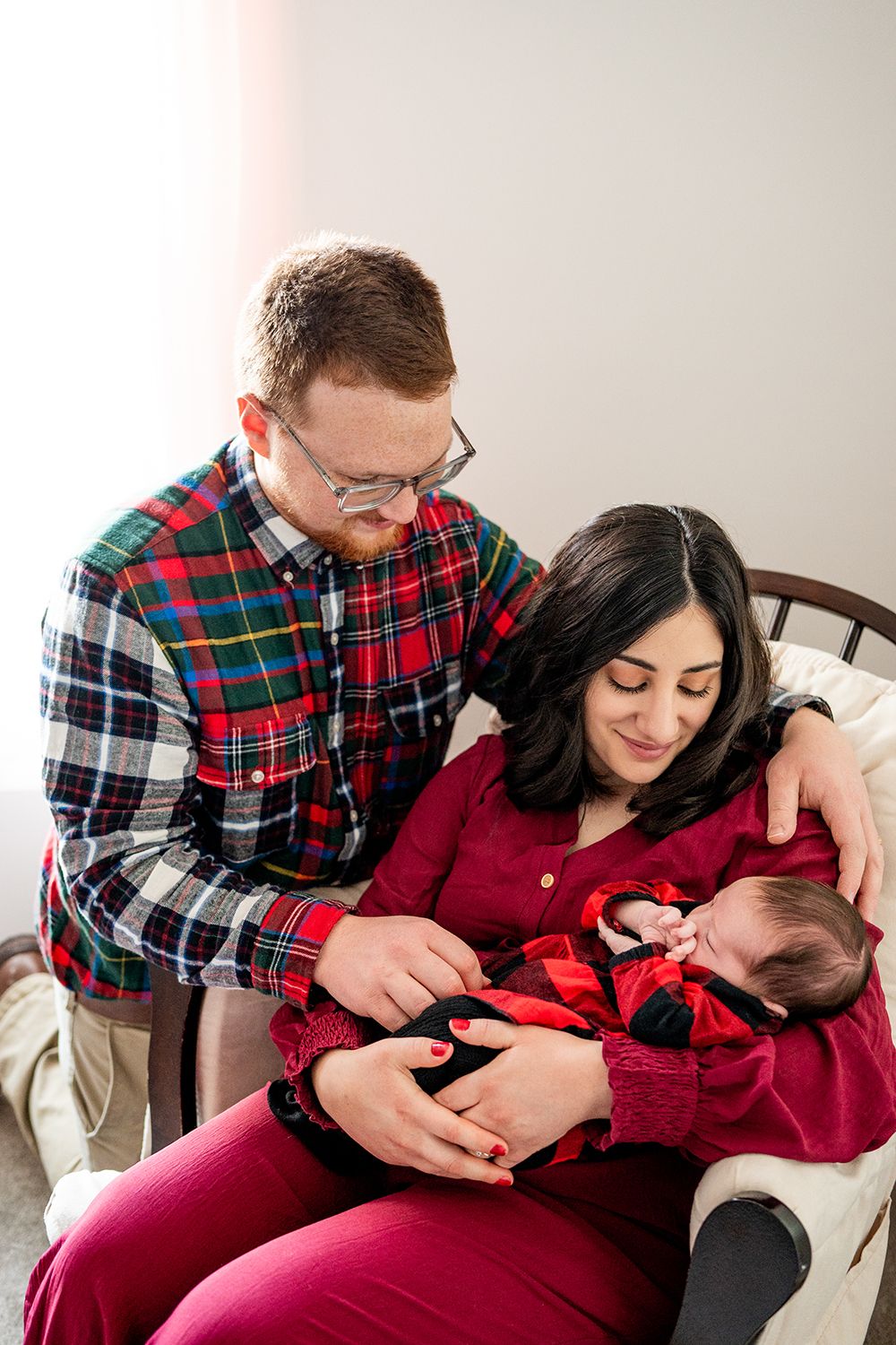 A couple in matching plaid and burgundy clothing sits together in three progressively more intimate poses.