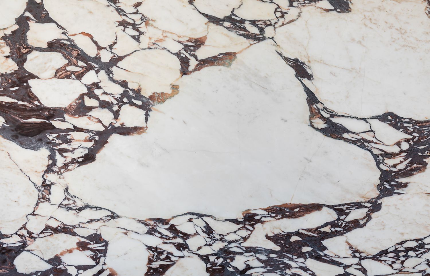 White and burgundy marble with dramatic veining pattern creating abstract natural patterns across the surface.