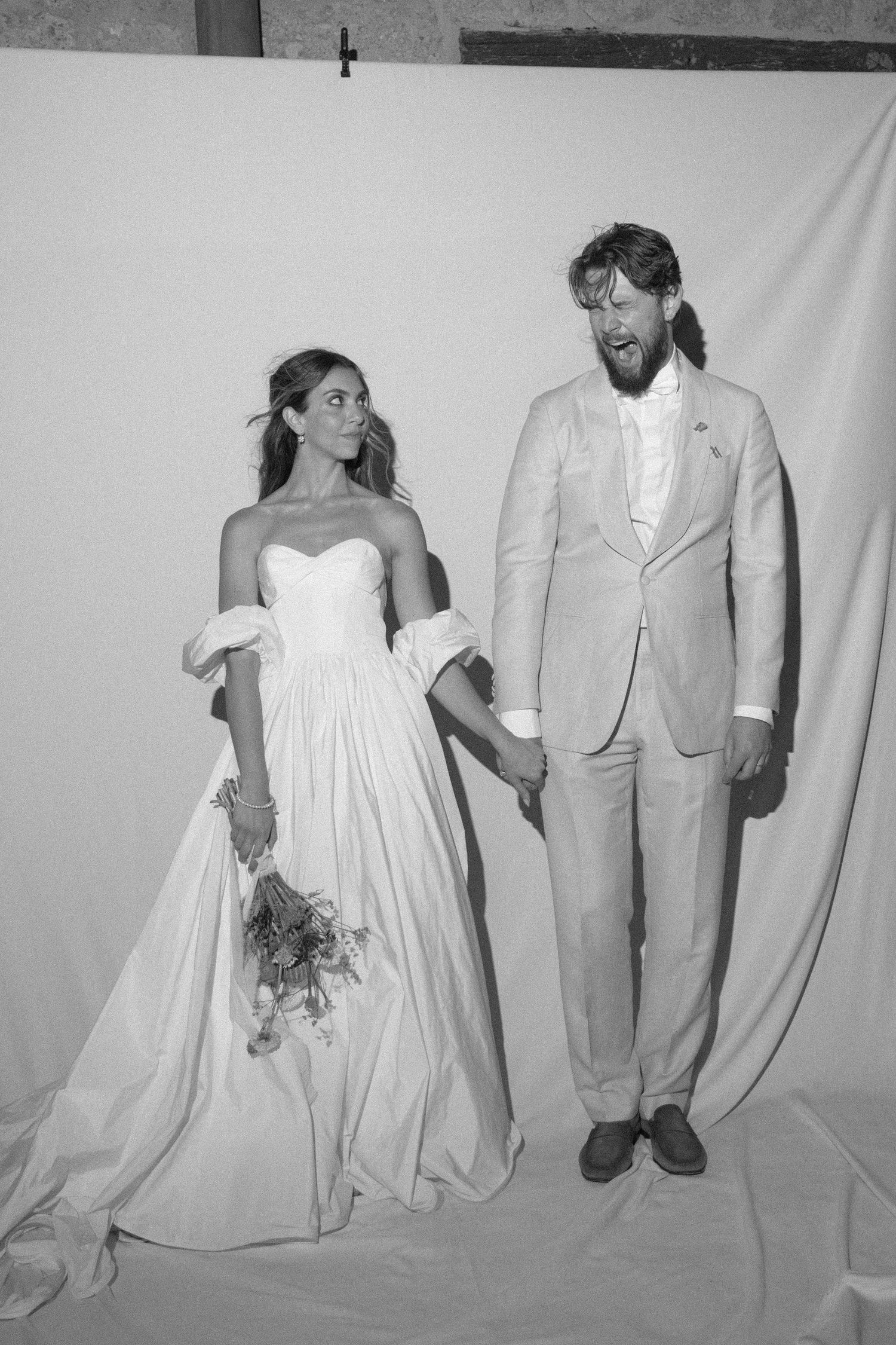 A series of black and white wedding photos showing couples in white dresses and light suits against a simple backdrop.
