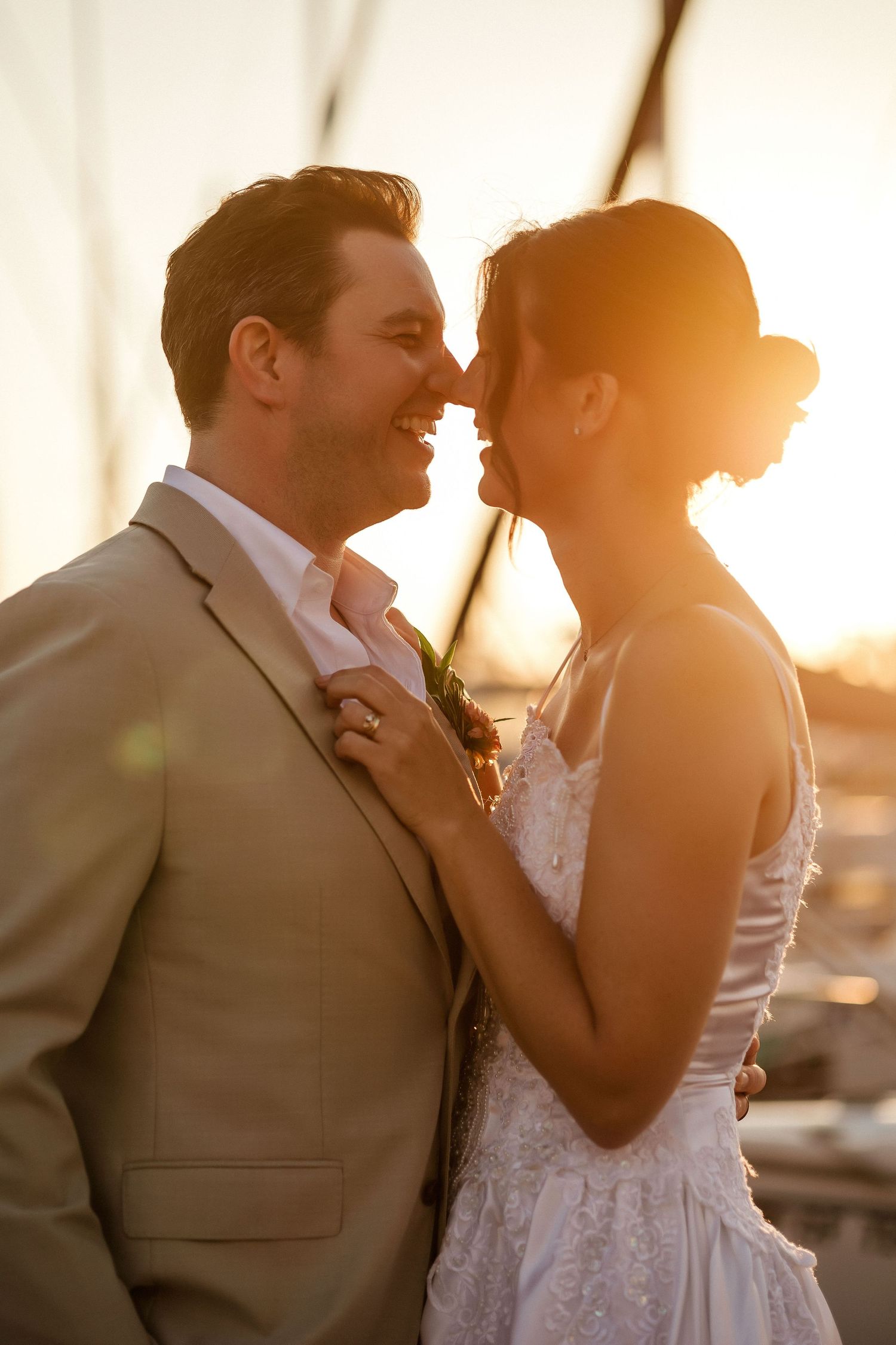 Wedding couple being cozy together.