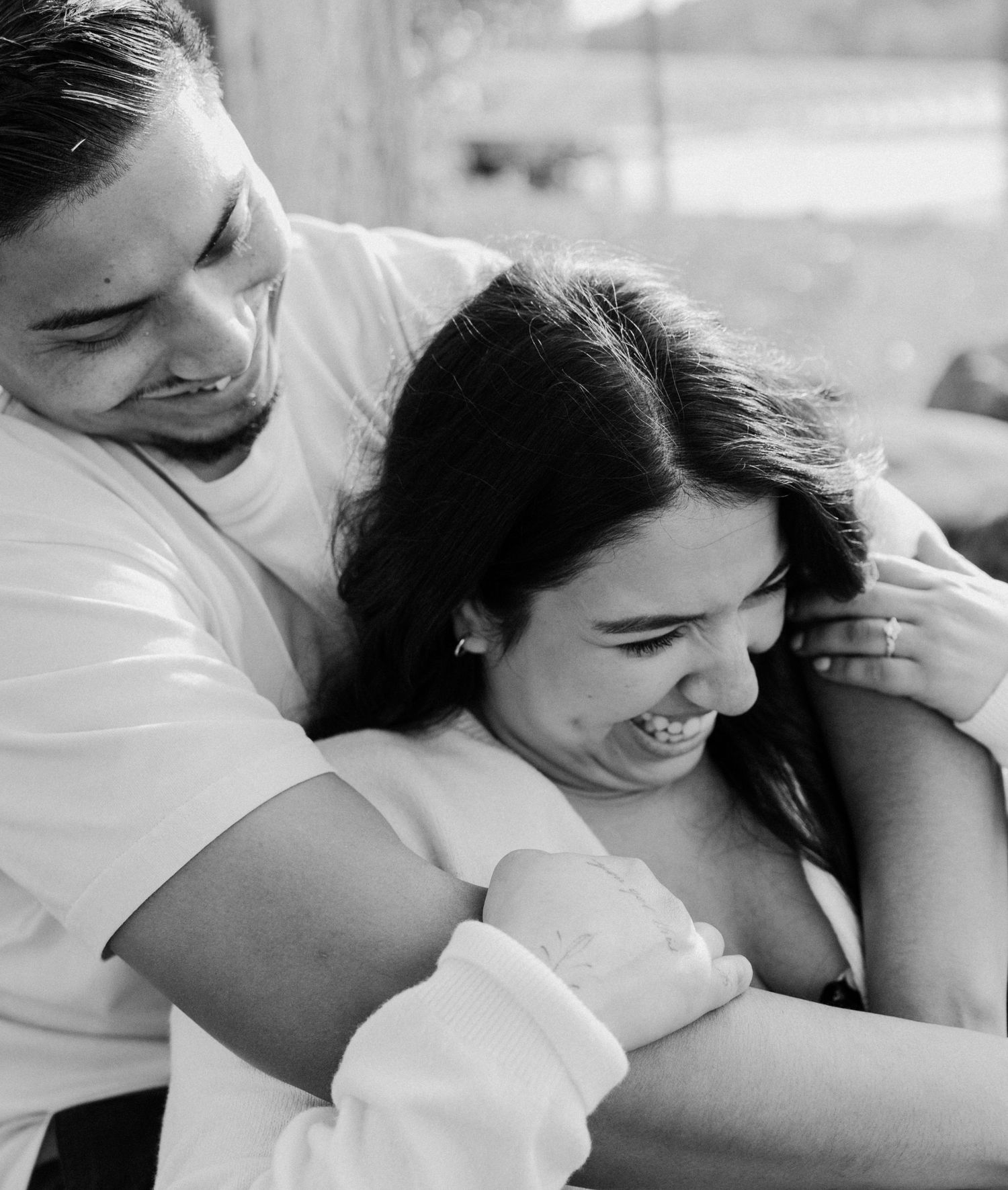 Intimate black and white photo series showing tender moments of closeness between a couple.