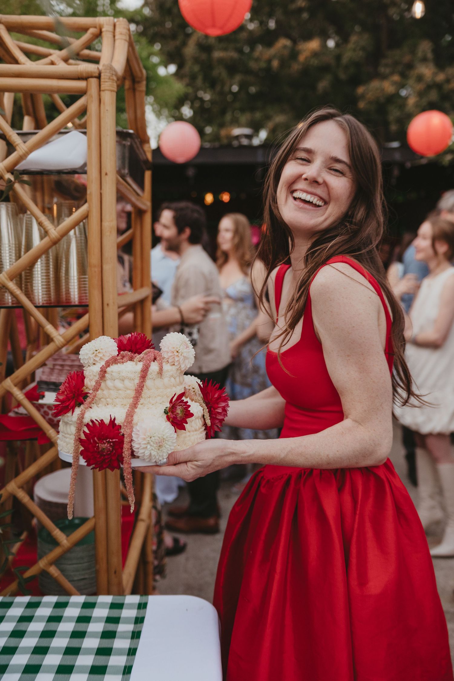 A sequence of joyful moments captured at an outdoor event showing someone in a vibrant red dress dancing and twirling.