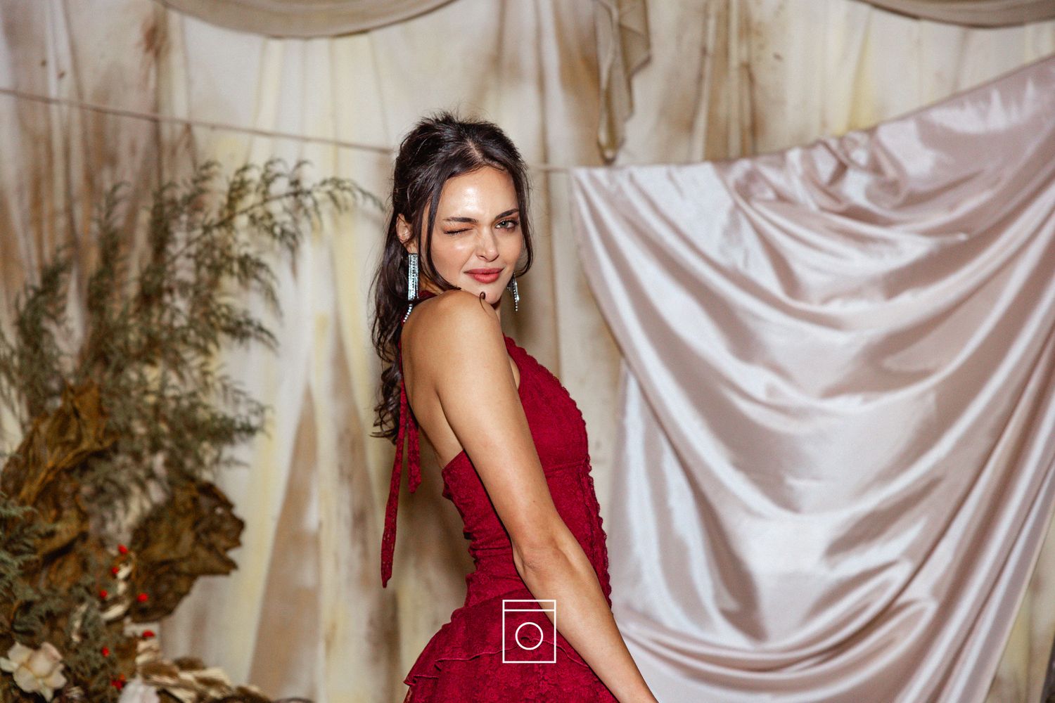 A collection of dance portraits featuring performers in red and white costumes against elegant fabric backdrops.