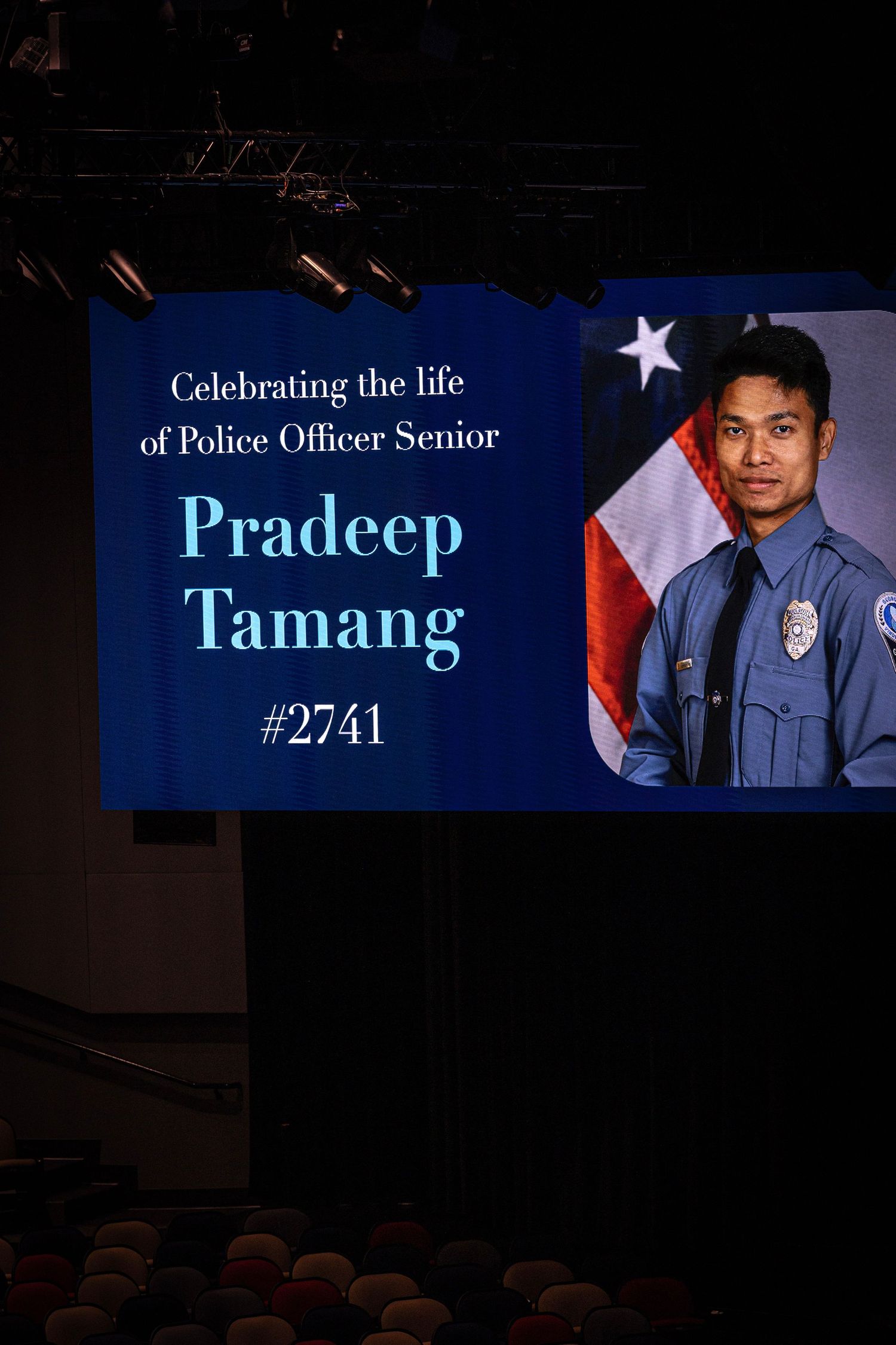 Memorial display honoring Police Officer #2741 with American flag backdrop.