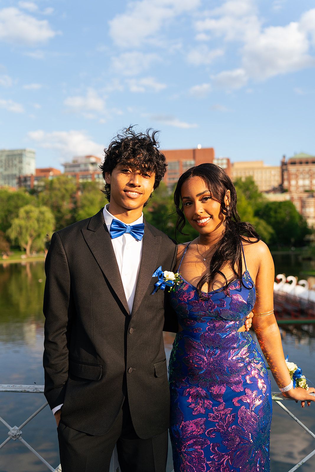 A prom couple poses at Boston Public Garden.