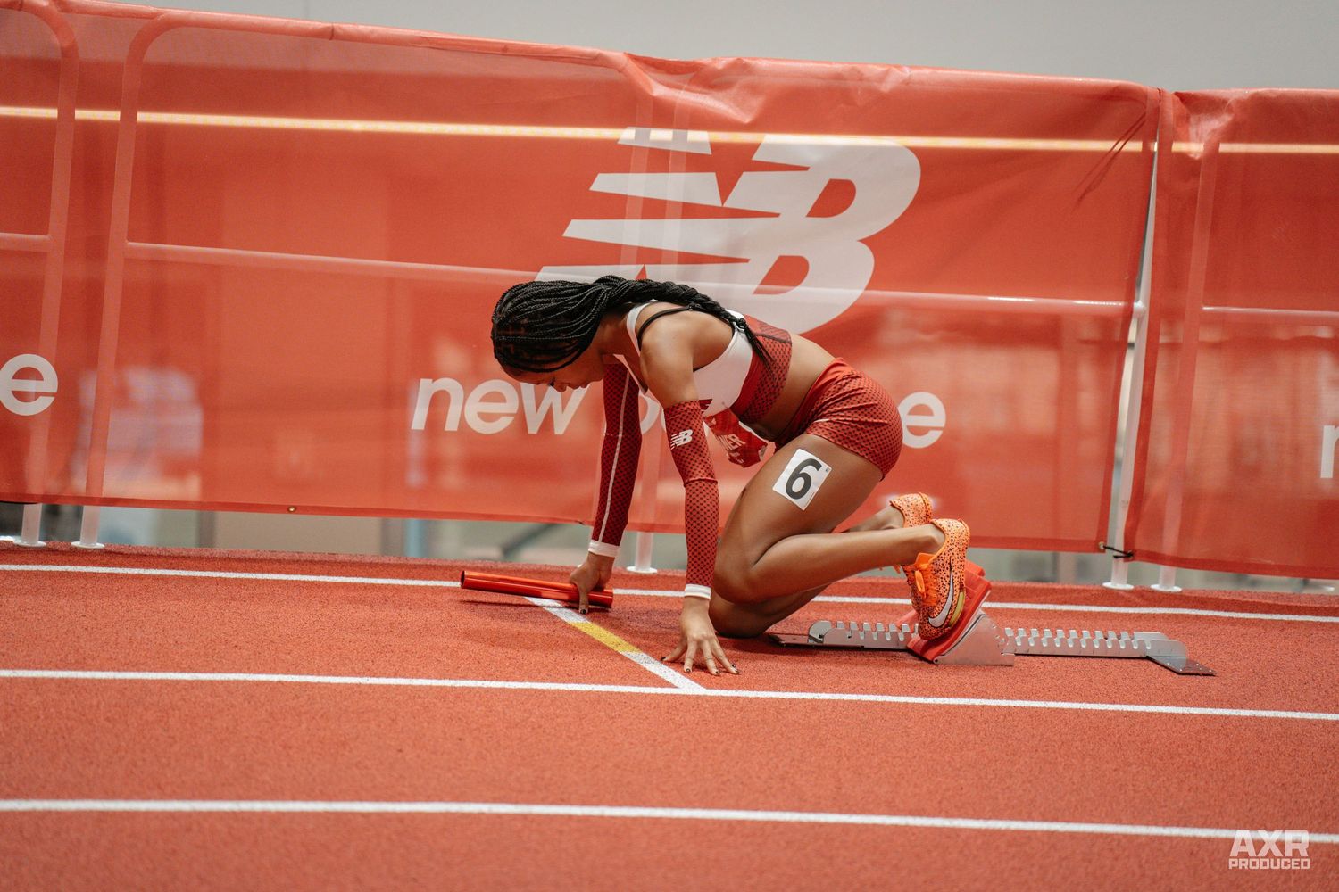 A girl prepares for her relay.