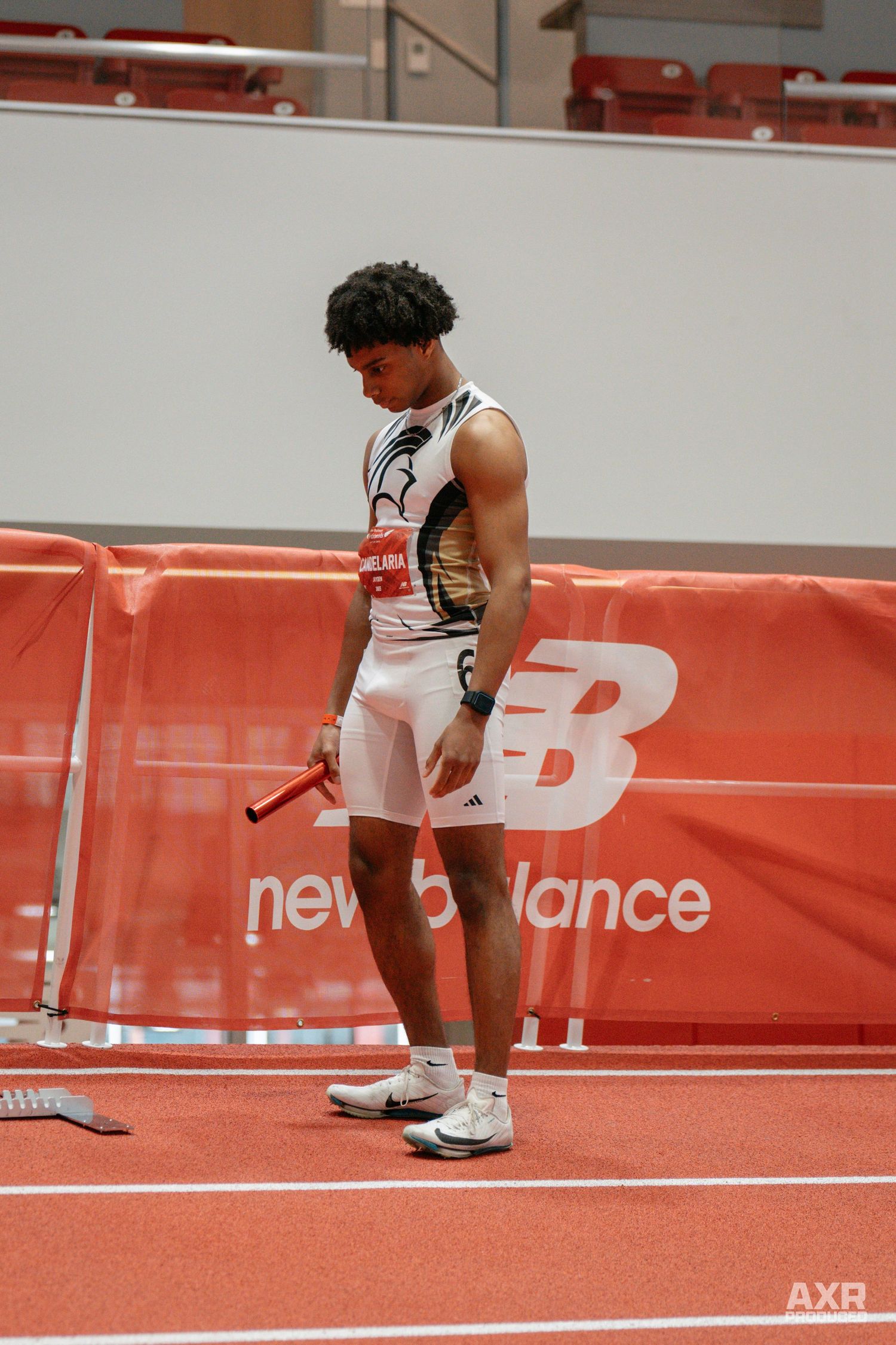 A track runner prepares for his 300 meter.