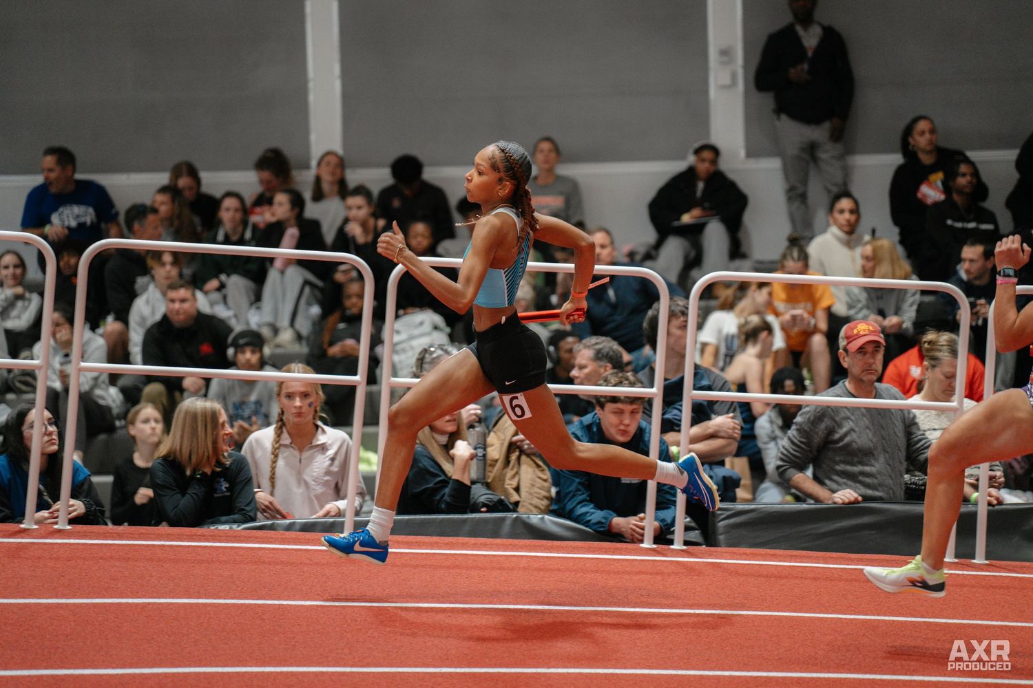 A girl dashes down the track