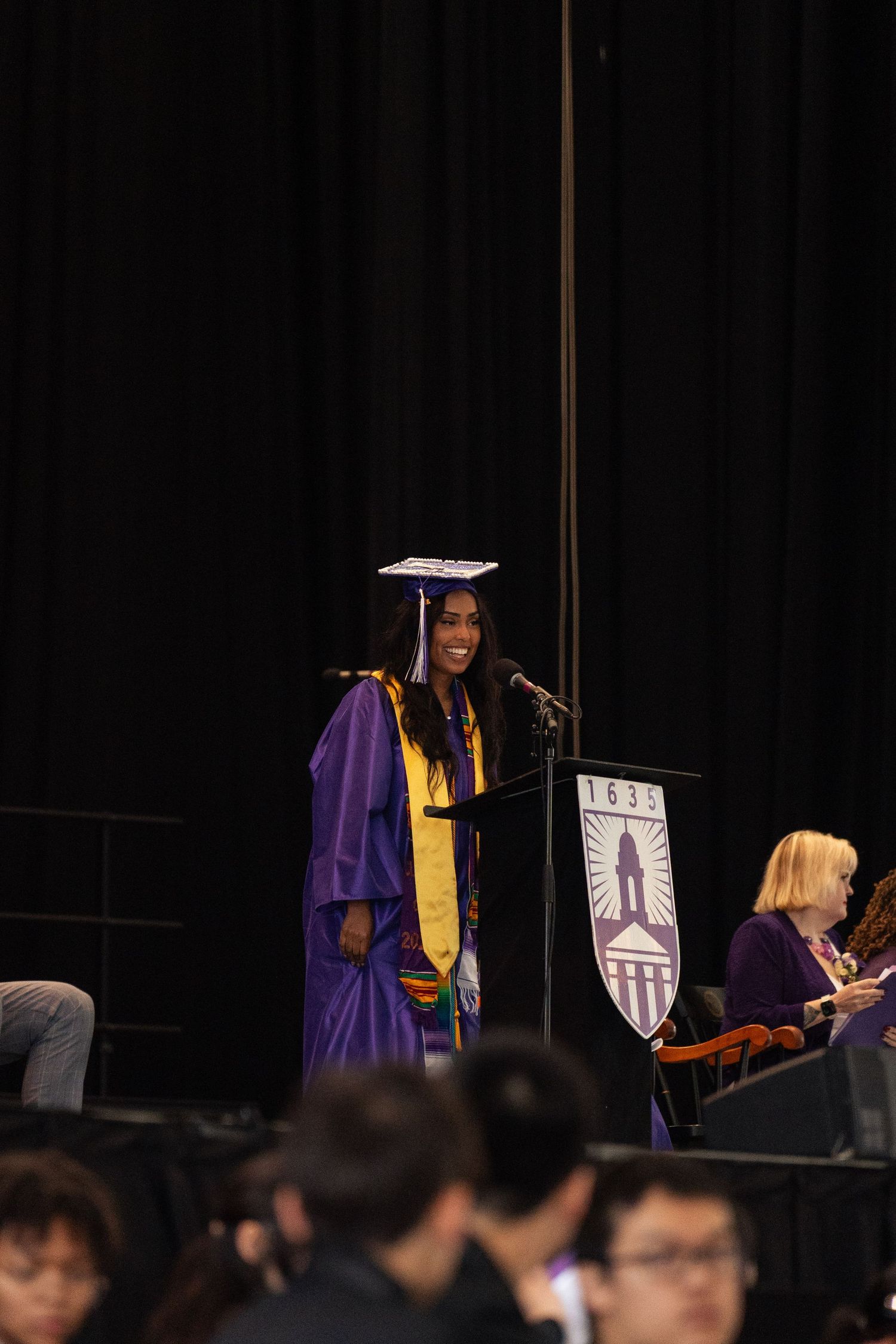 A girl speaks at her graduation ceremony.