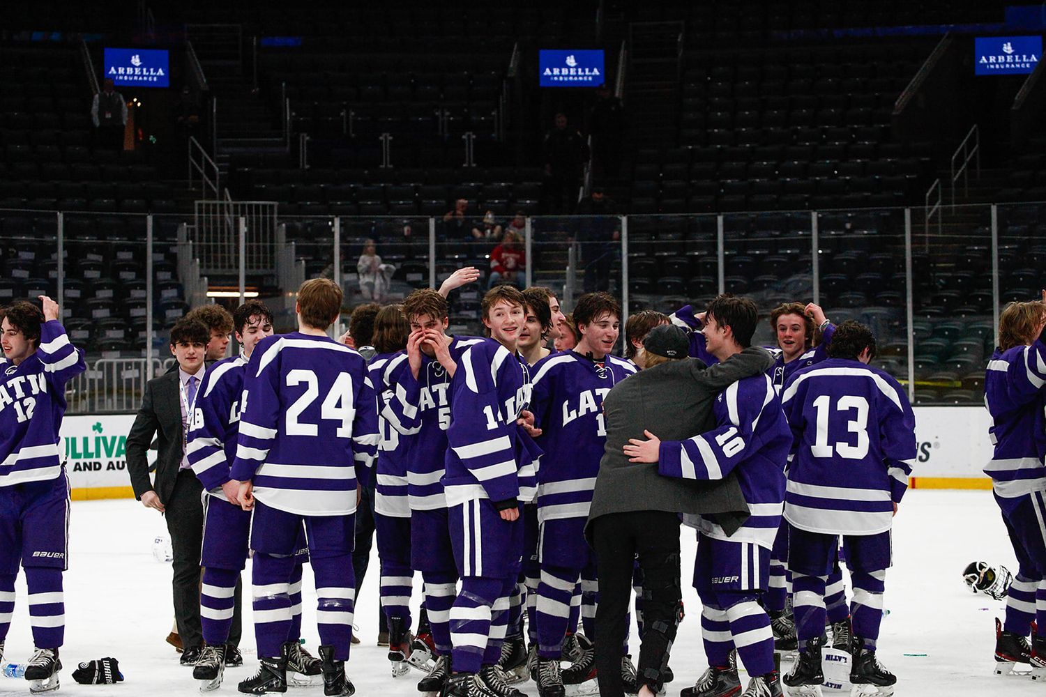 The hockey team celebrates a victory with one another