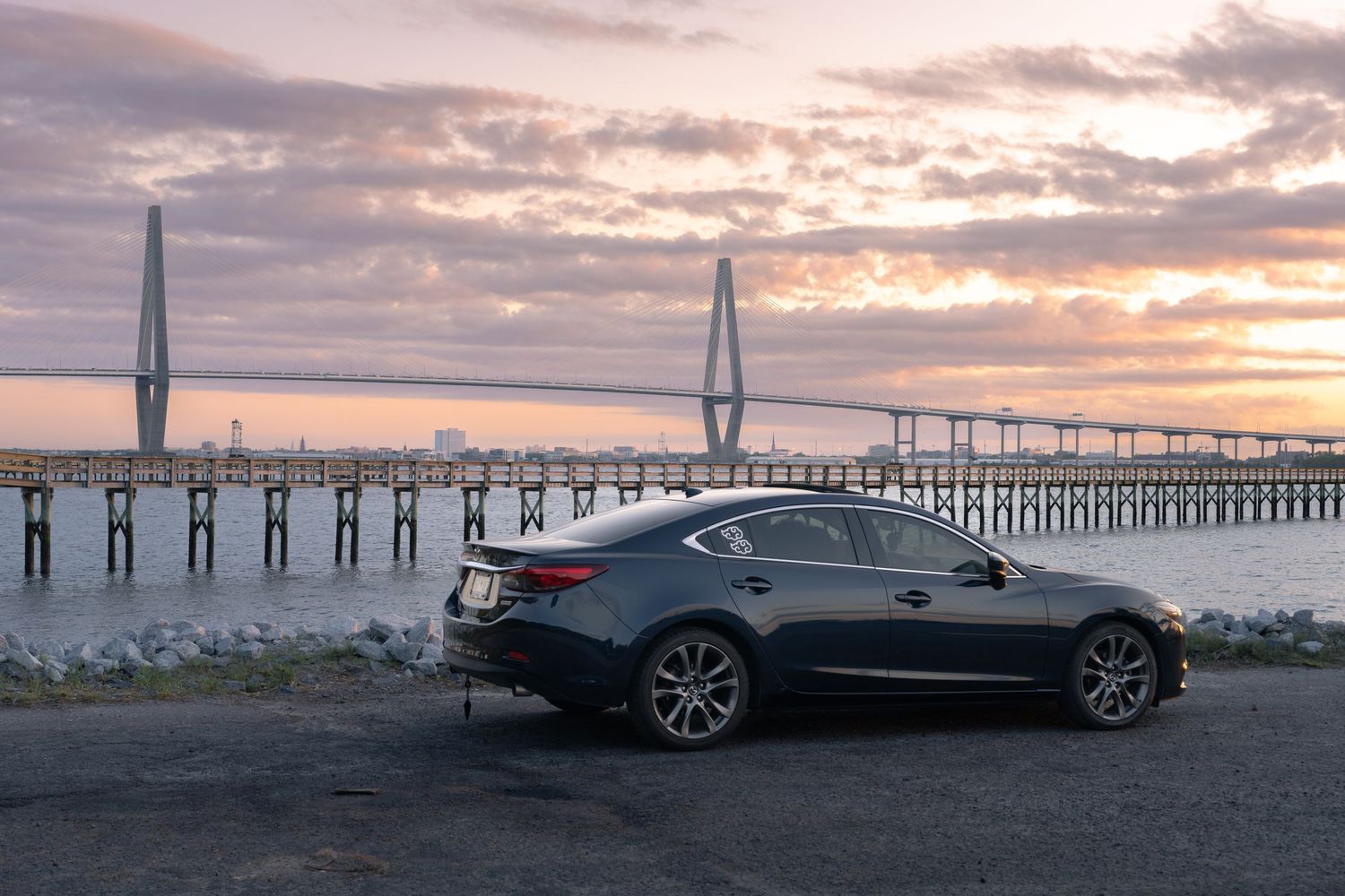 Cooper River bridge background with car in foreground