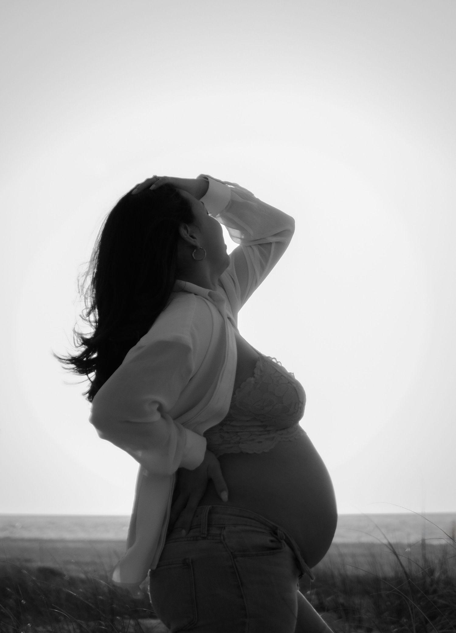 A black and white artistic photo sequence shows a person leaning back in silhouette against a bright sky.