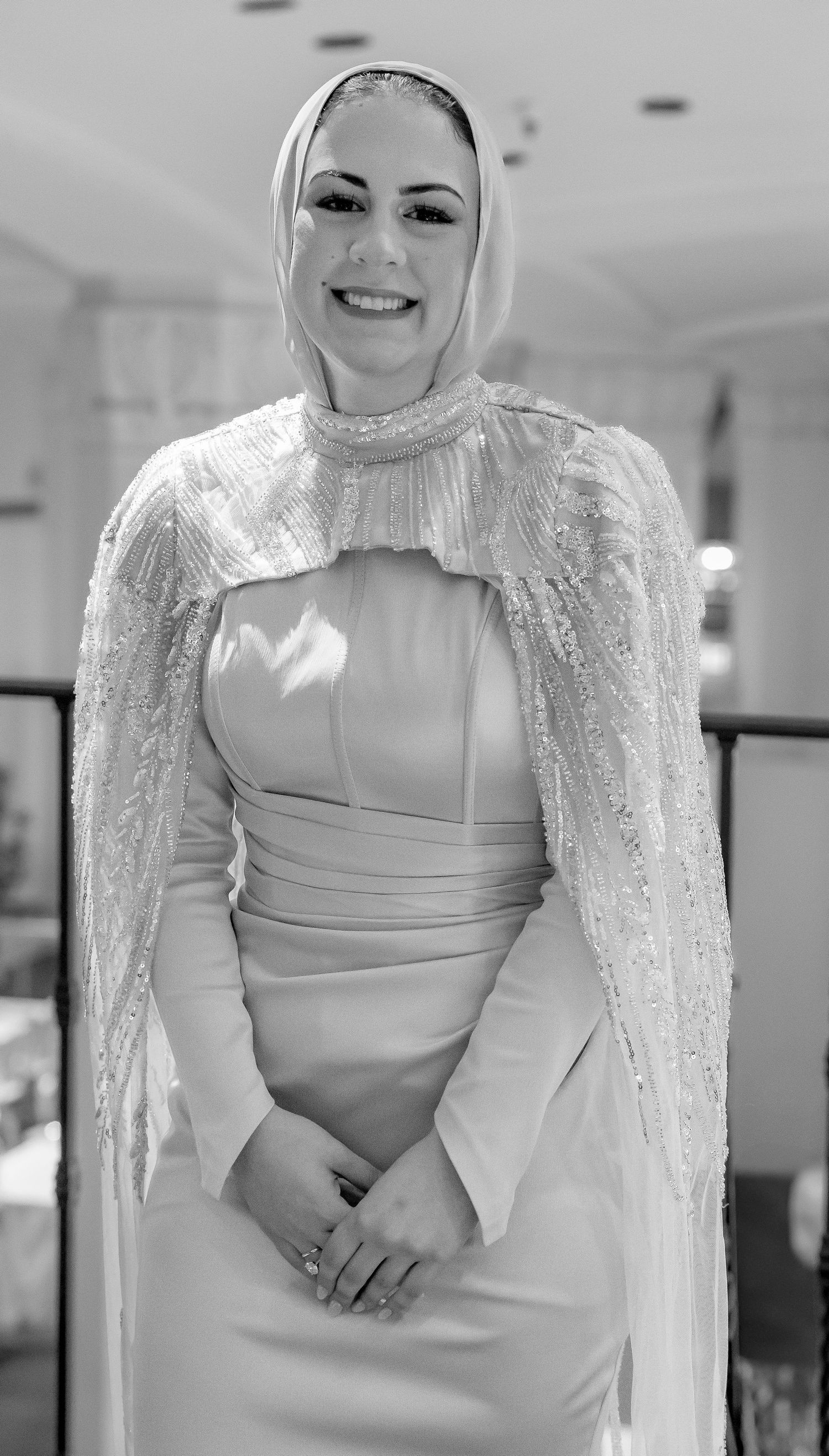 A series of bridal portraits showing a white wedding dress with lace details and hijab in an indoor setting.