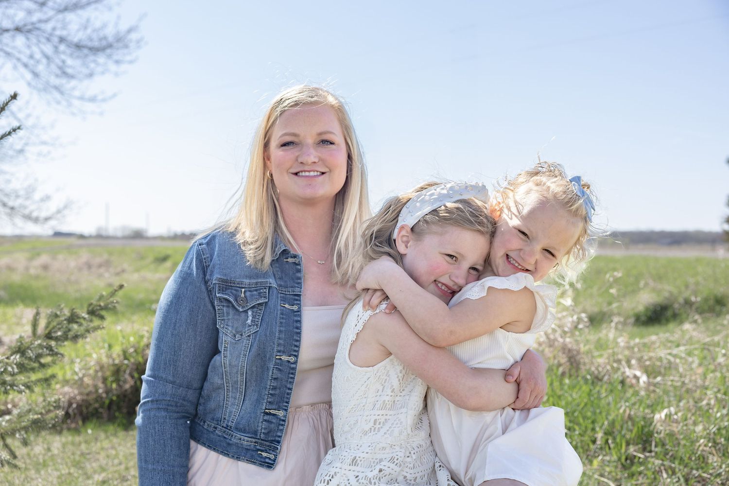 Candid family moments captured in golden sunlight among wildflowers.