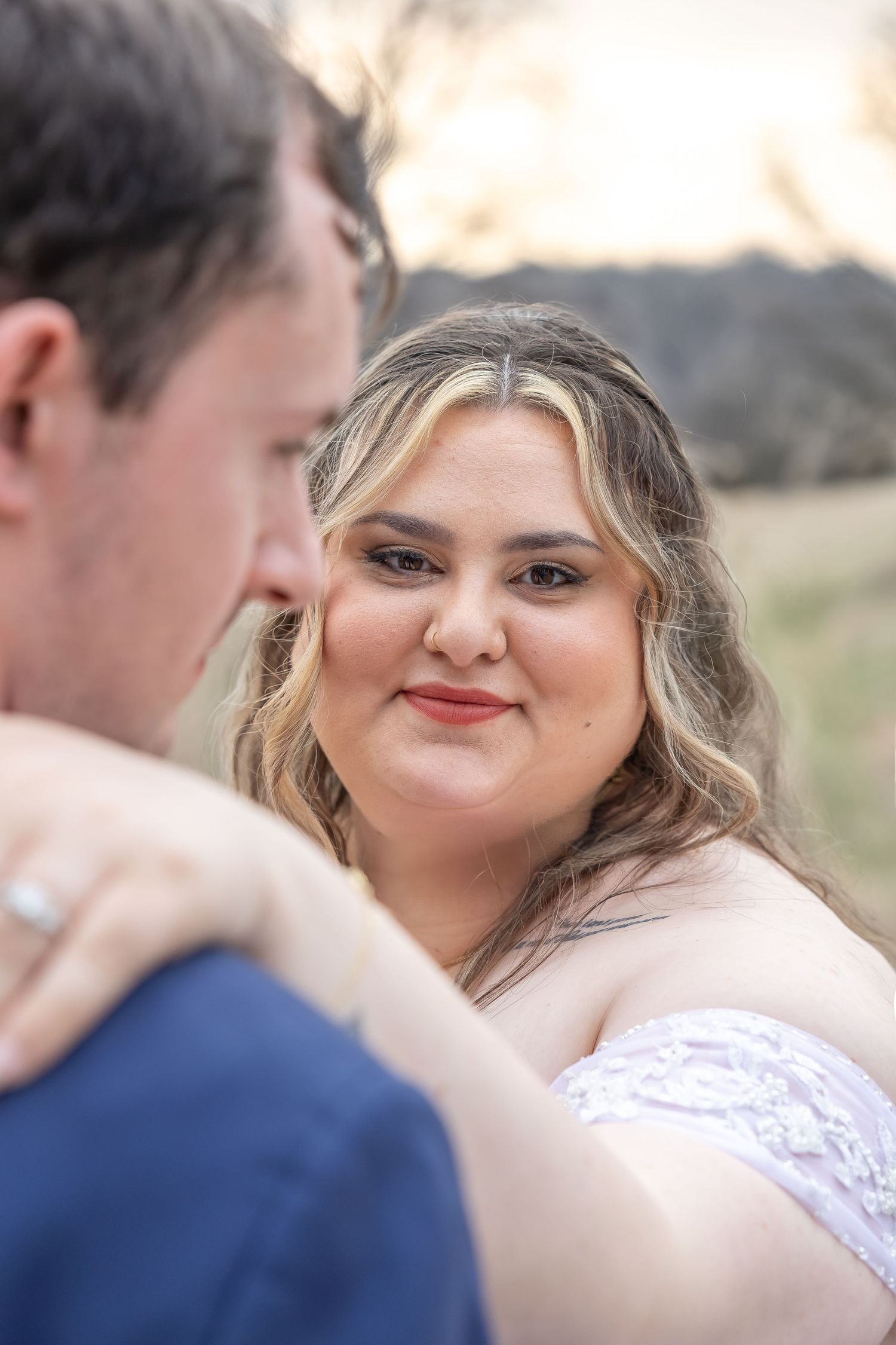 Close-up wedding photos showing emotional expressions and tender moments between newlyweds.