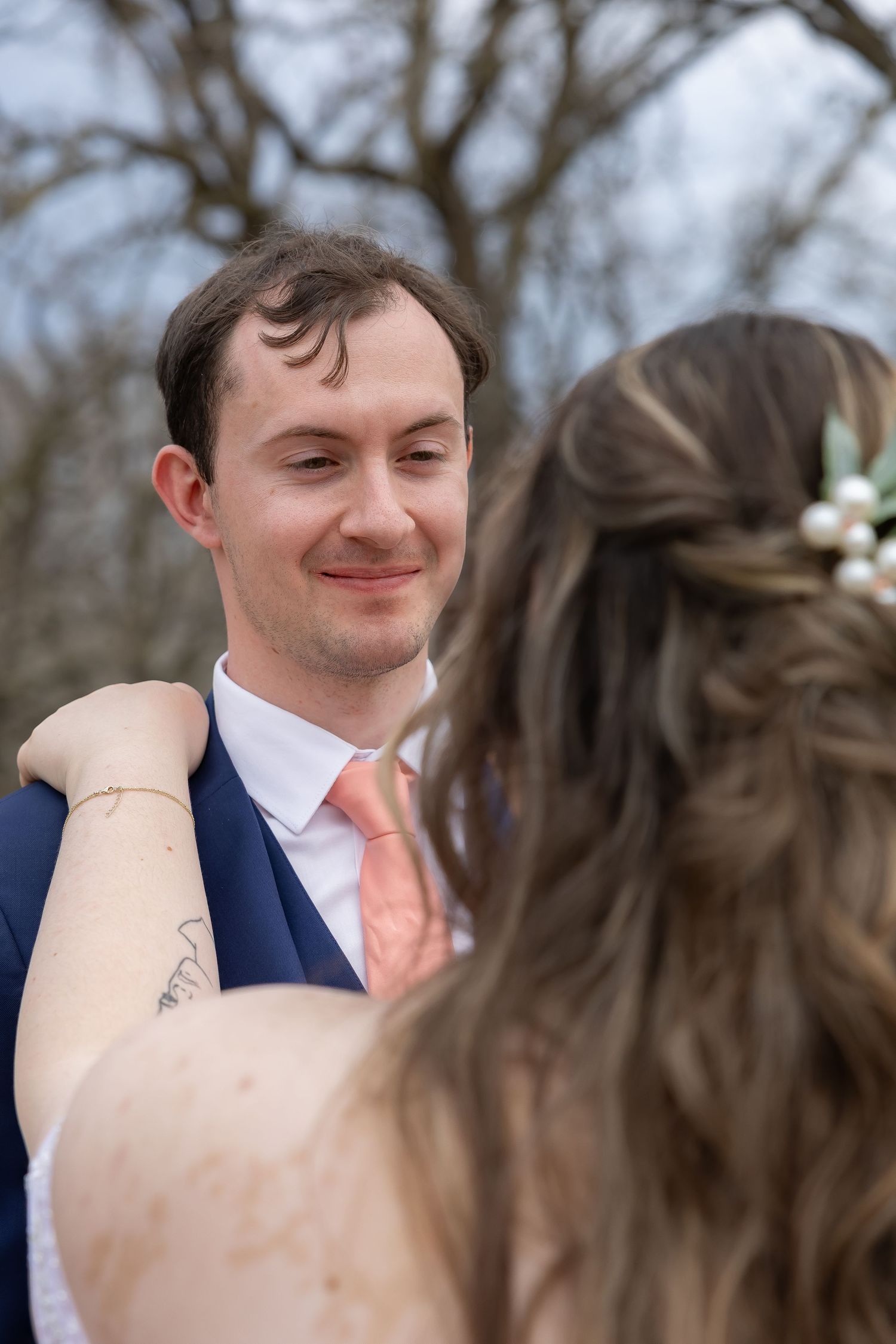 Close-up wedding moment sequence captured in natural outdoor lighting.