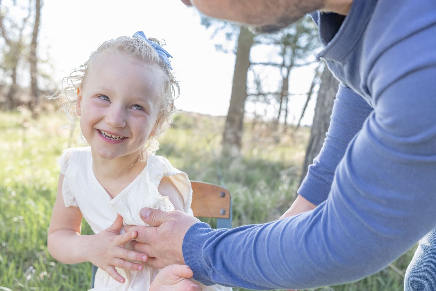 Close-up shots of joyful family interactions in an outdoor setting.