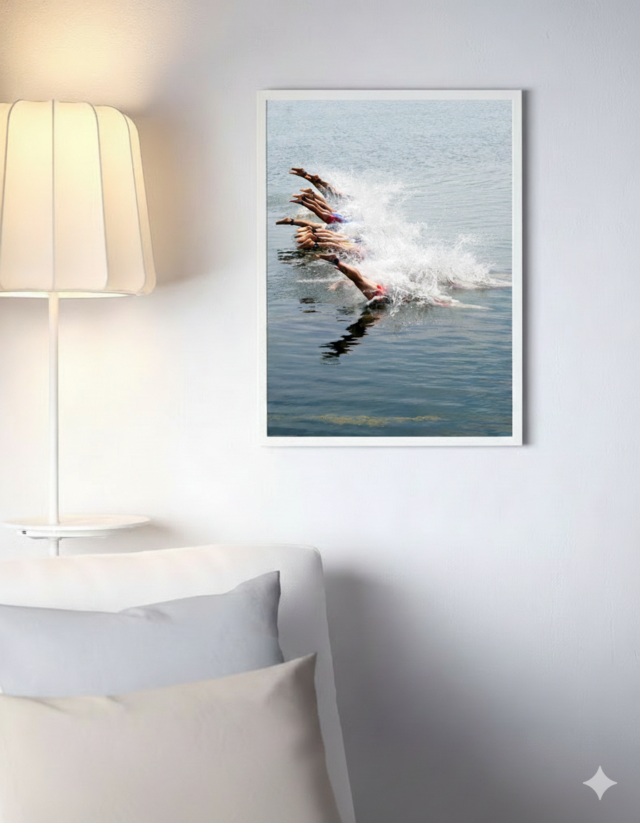 A white couch adorned with an image of a swimmer, adding a sporty touch to the room's decor.