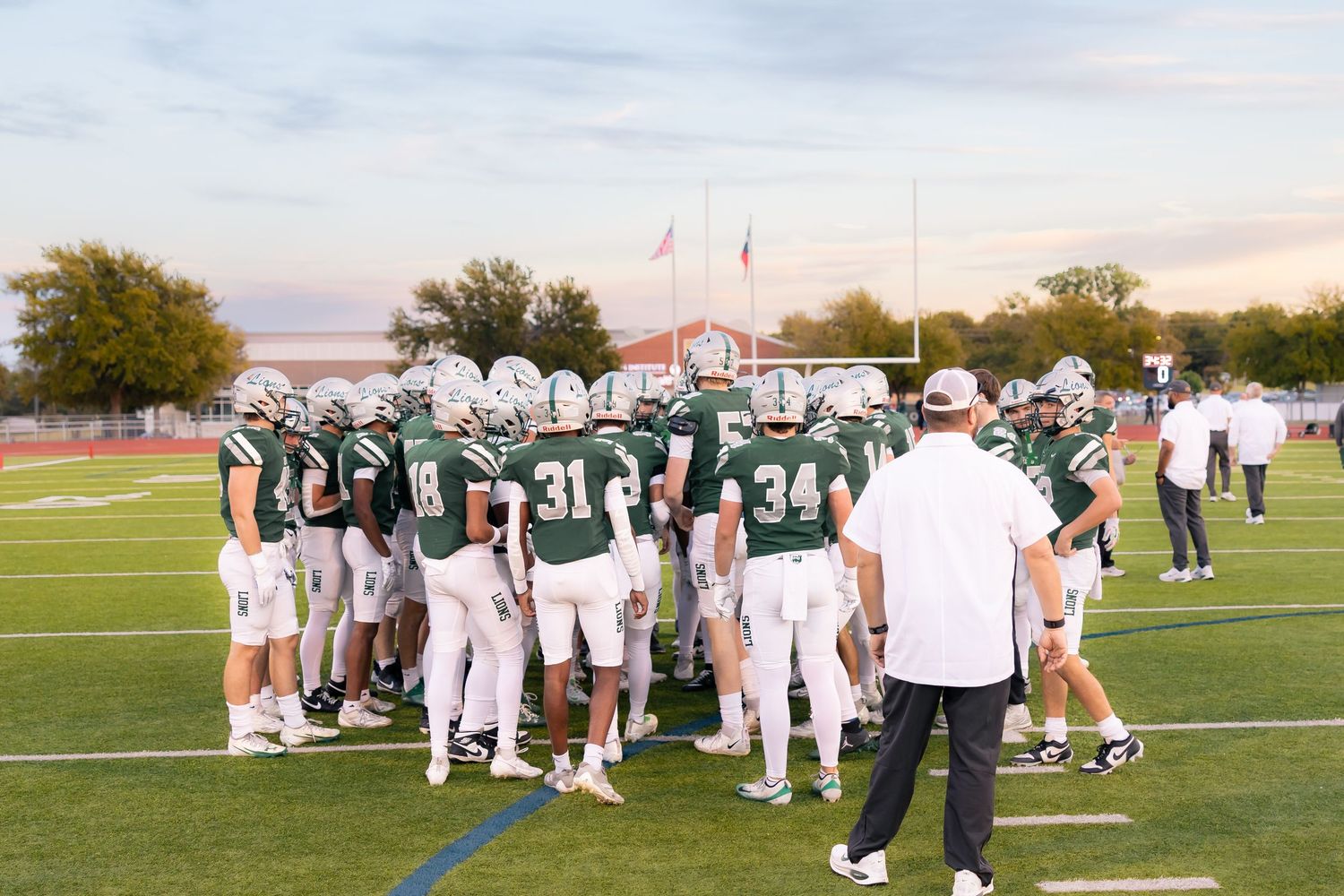 Reedy Varsity Football Teams Huddle