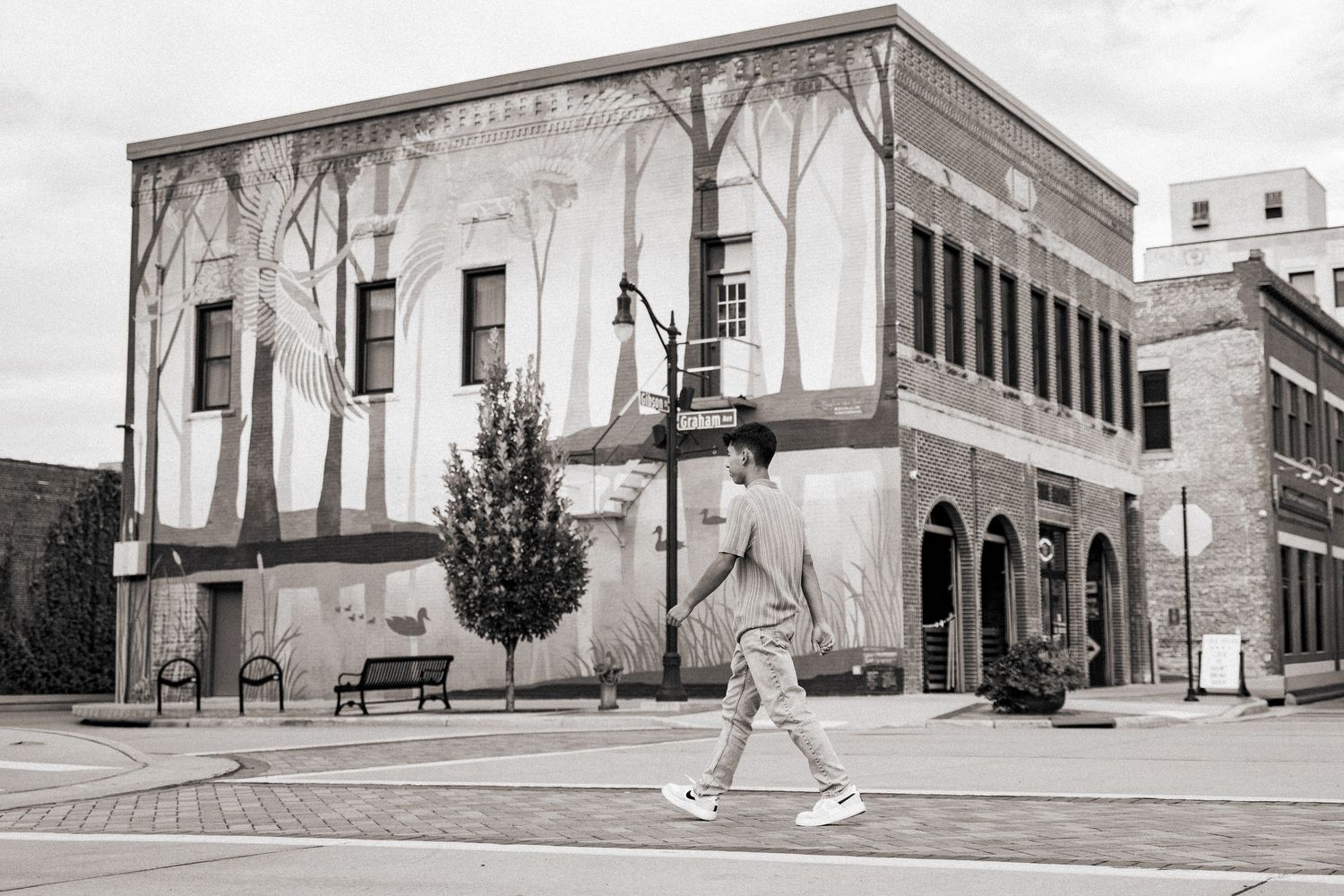 Panoramic view of classical architecture building exterior with stone columns and steps.