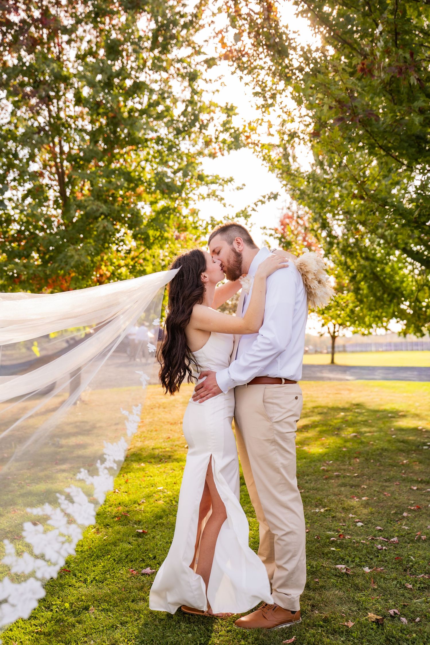 Wisconsin wedding photography featuring a bride with long veil outdoors