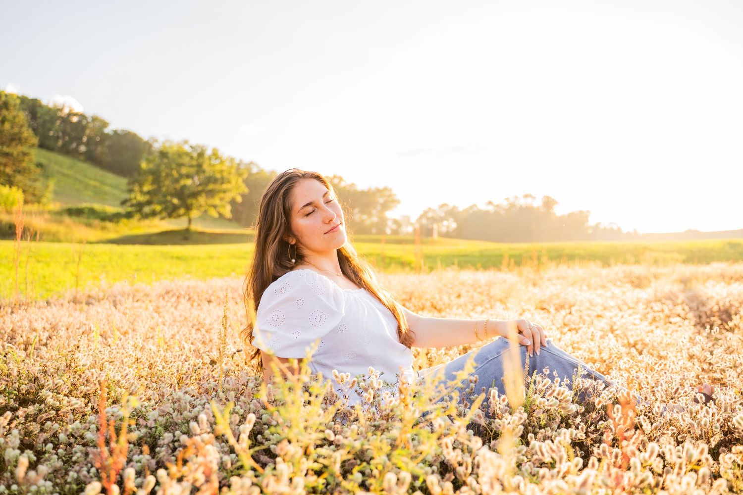 A series of golden hour portrait shots in a sunlit field with wildflowers in Wisconsin