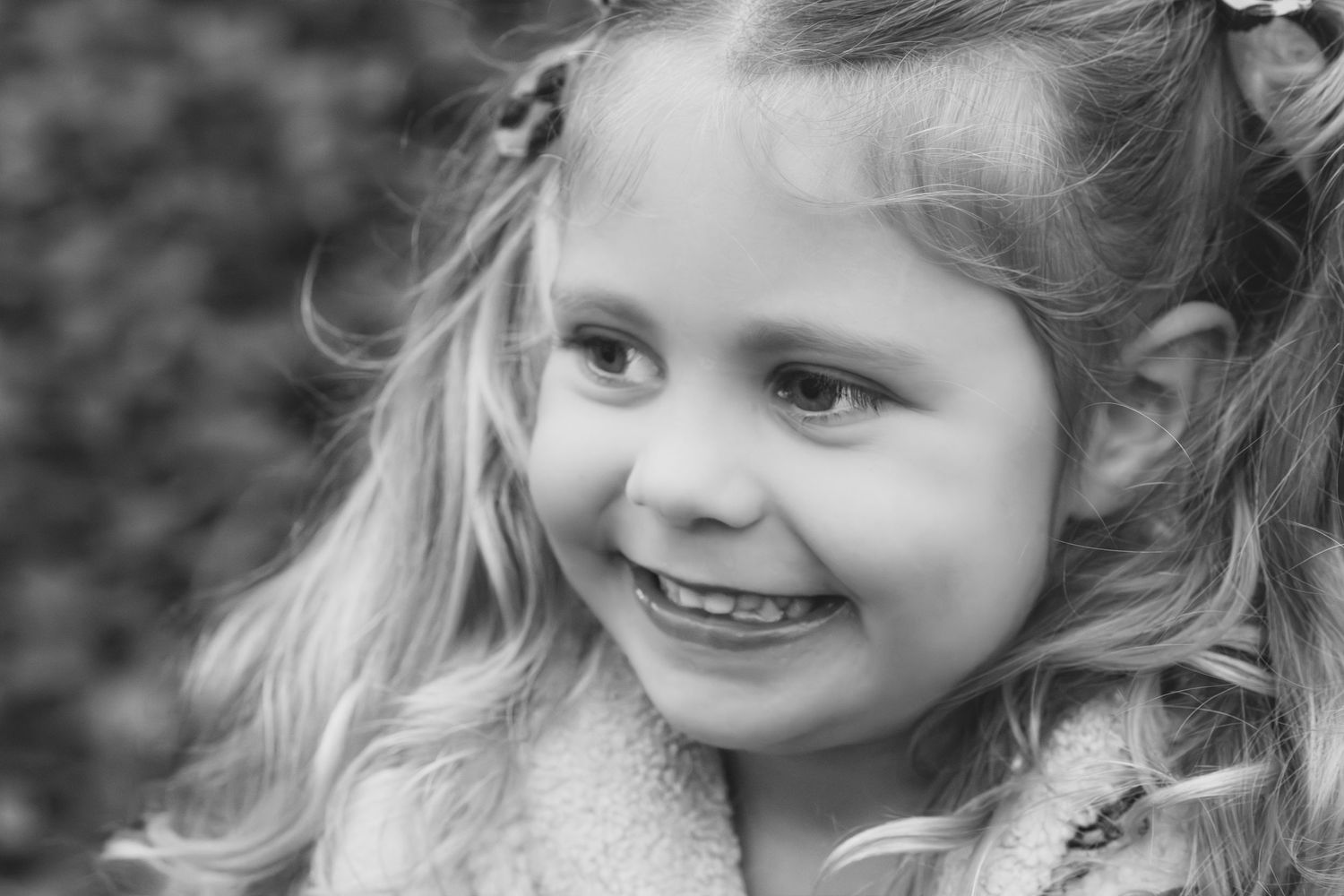 Family photograph. Black and white portrait series showing joyful expressions and tender moments.