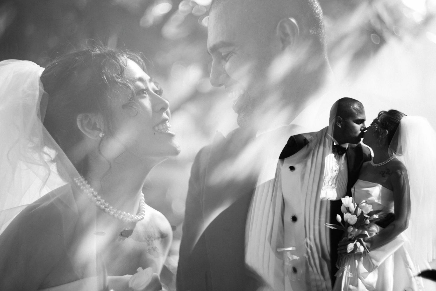 Artistic black and white wedding portrait with soft lighting and romantic composition.