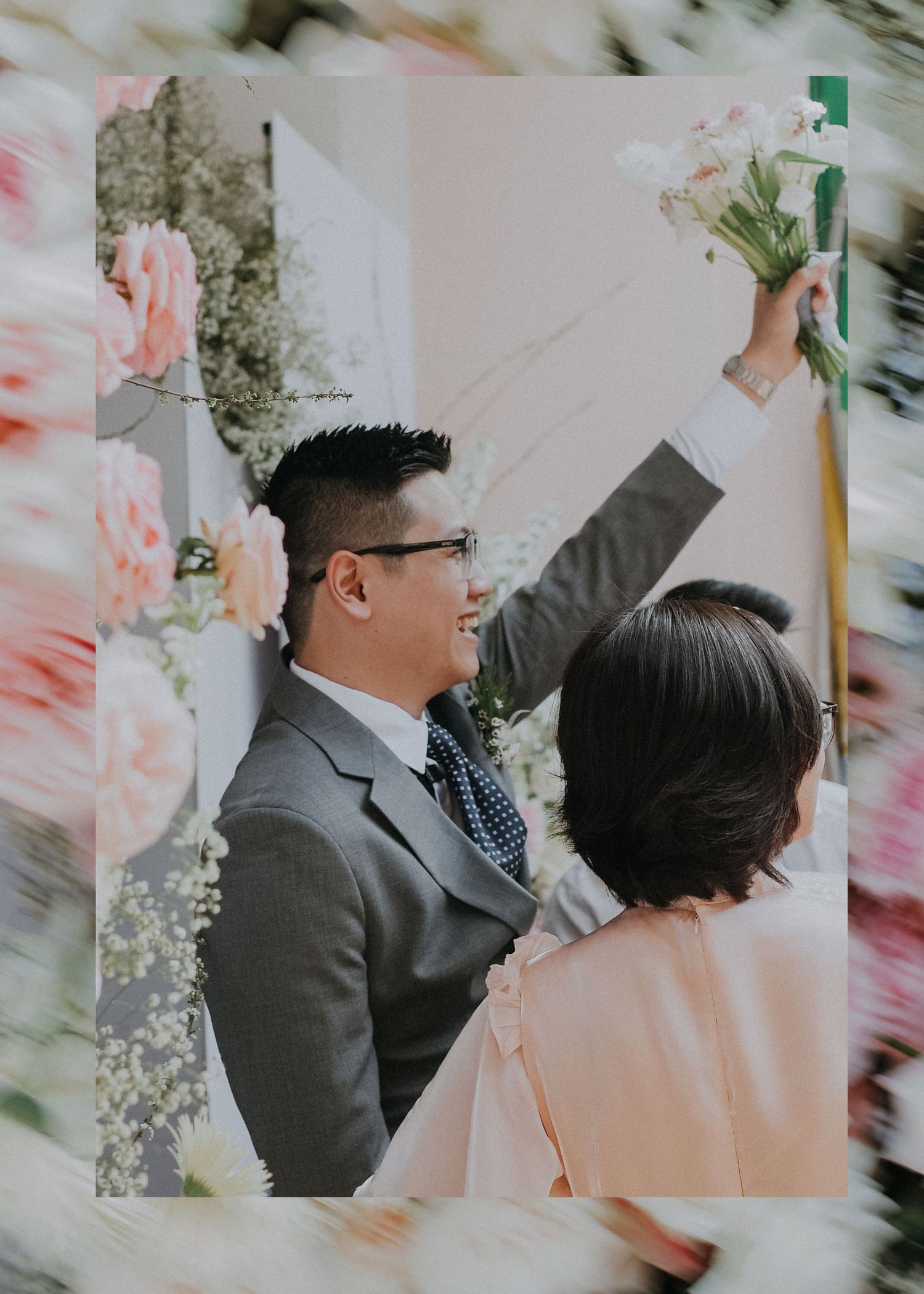 Wedding celebration moment with floral decorations in soft pink tones.