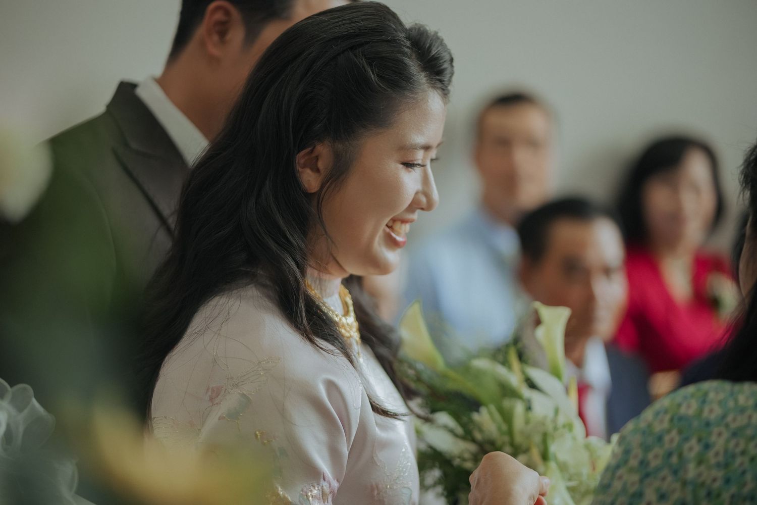 Candid reception moment showing traditional Vietnamese wedding celebrations.