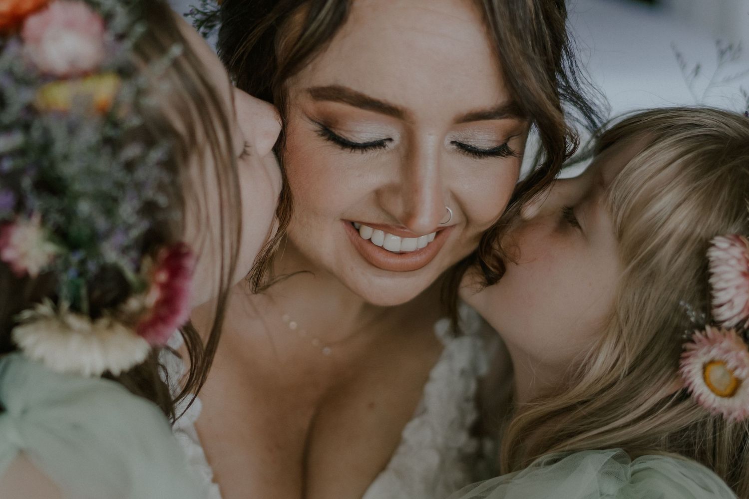 Intimate moment captured with soft lighting and floral decorations.