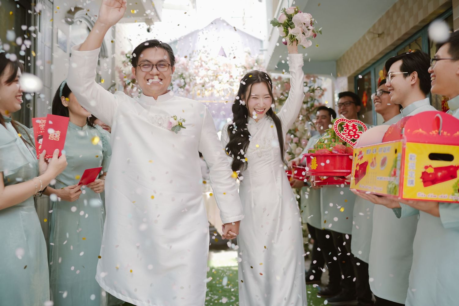 Celebratory moment with confetti and gift-giving during a traditional wedding ceremony.