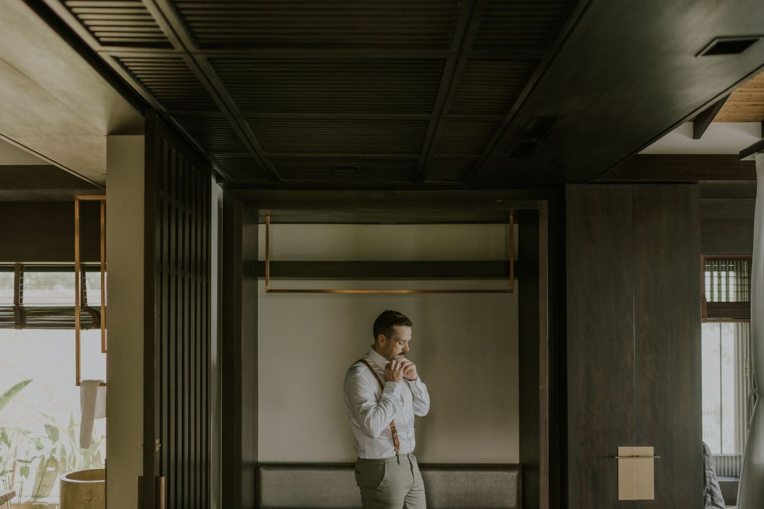 An atmospheric interior hallway shot with natural lighting streaming through windows.