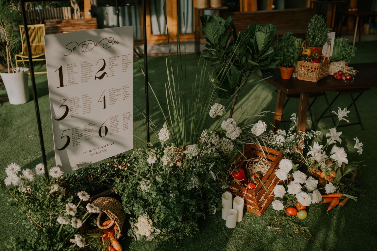 Garden-themed display with white florals, produce, and decorative elements.