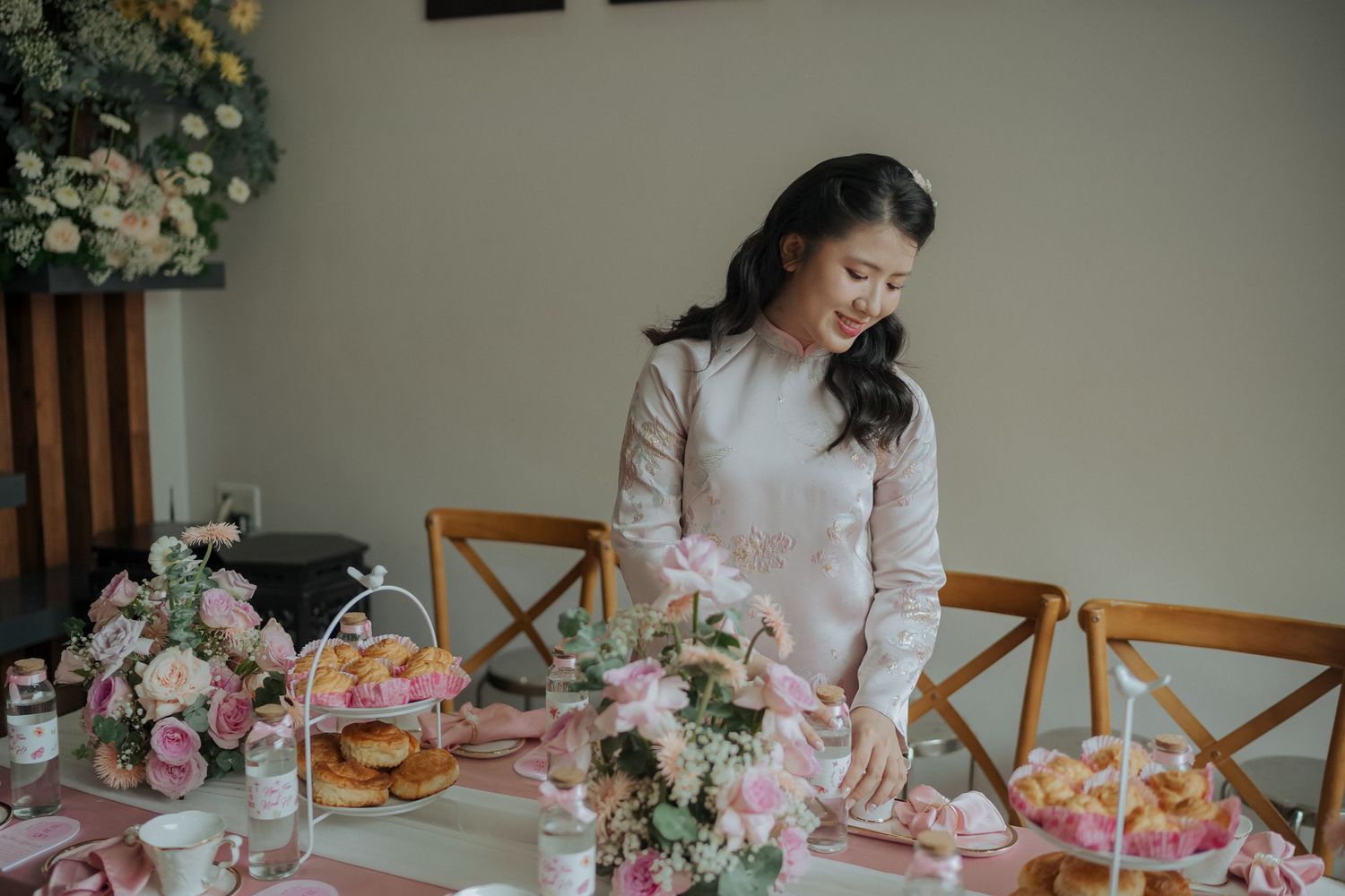 Pink and white decorated tea ceremony table with traditional settings.