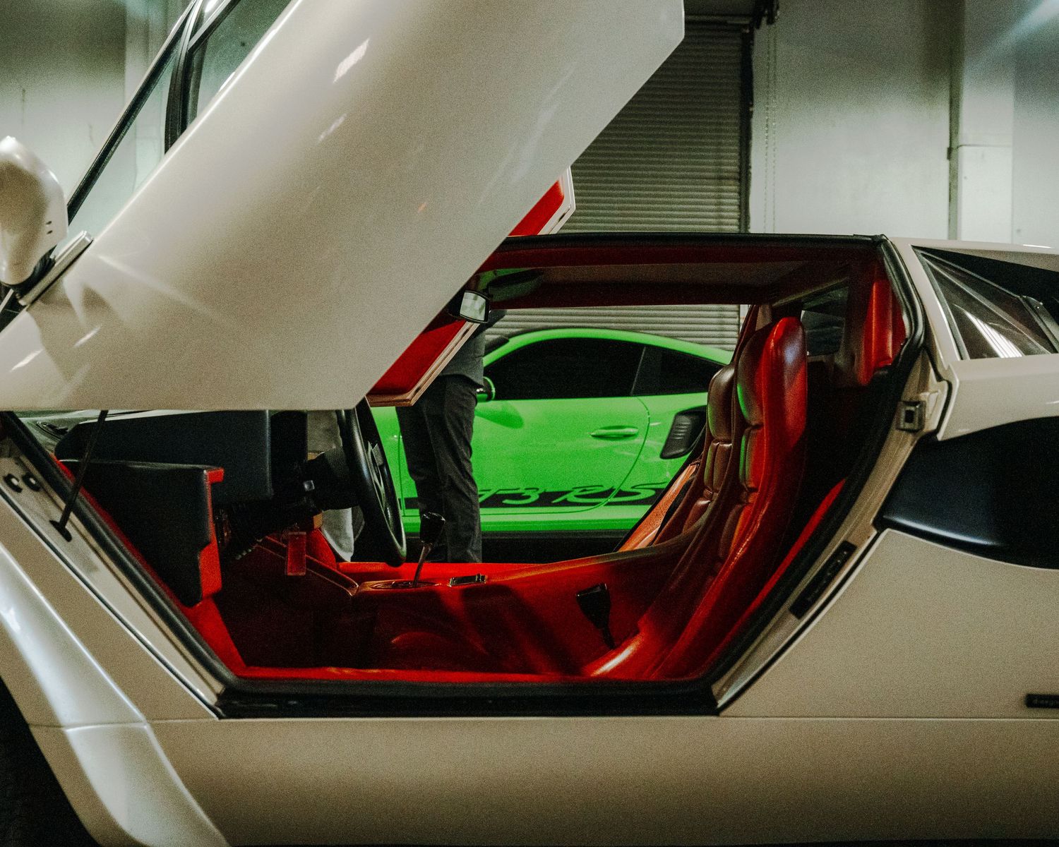 Camera pans across a white sports car with red interior lighting showing four different angles of the same vehicle.