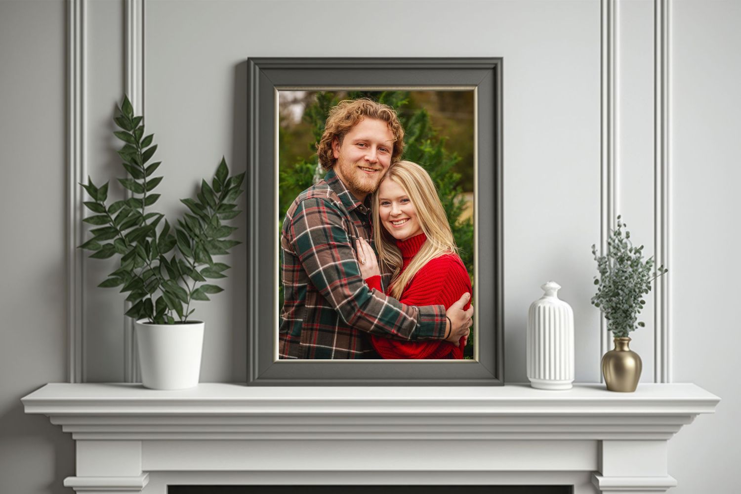 Elegant gray wall with framed photograph of couple and decorative shelf styling.