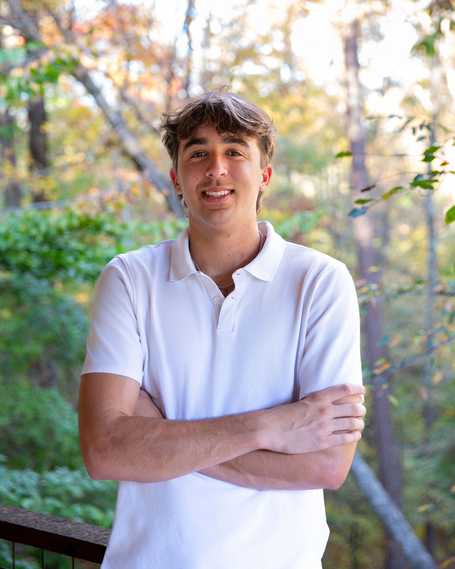 Series of casual outdoor portraits in white polo shirt against natural background.