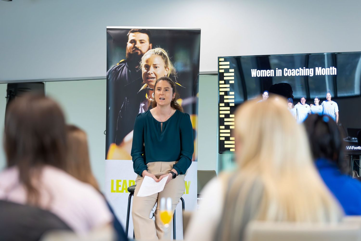 A montage of professionals in business attire presenting and speaking at various meetings and conferences.