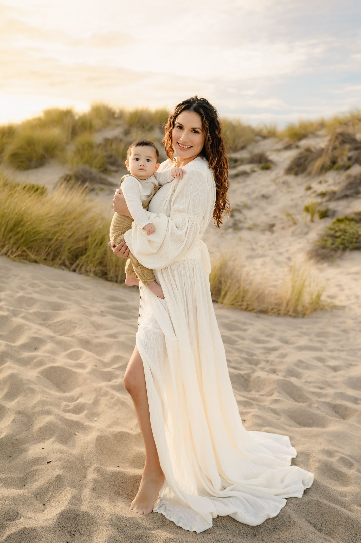 mom holding baby boy in dunes during sunset Oxnard beach mommy & me photos by San Diego photographer, Tiffany Kelterer