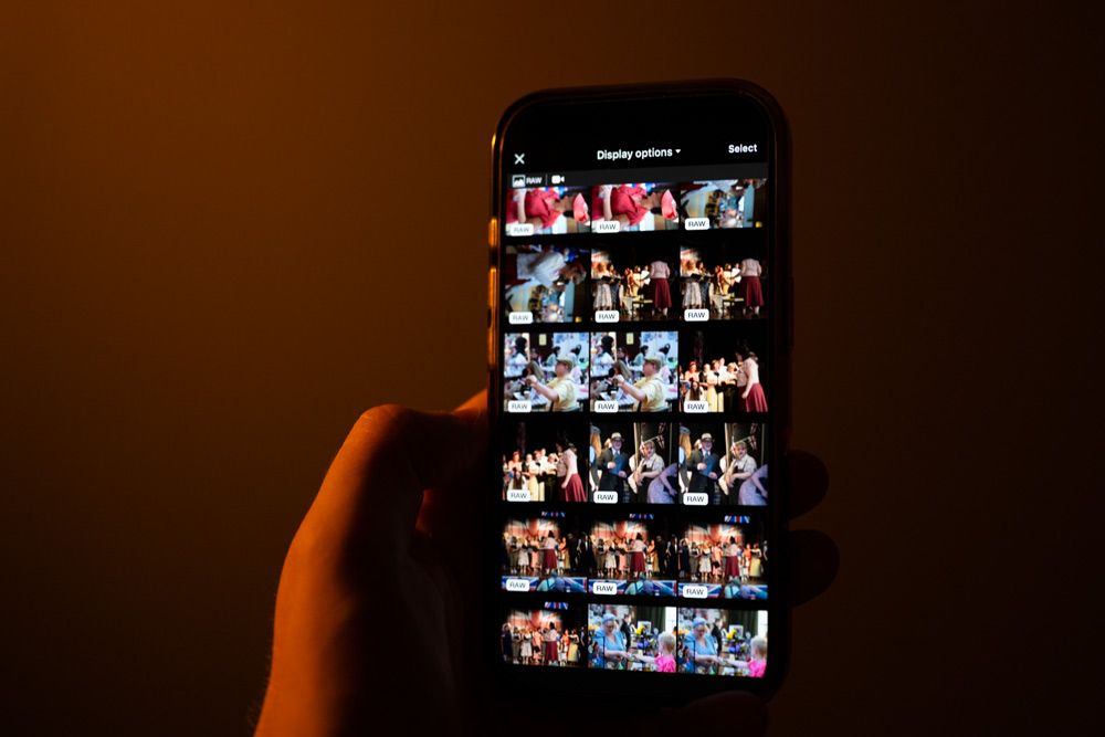 Mobile phone with downloaded images from the camera to send on location.