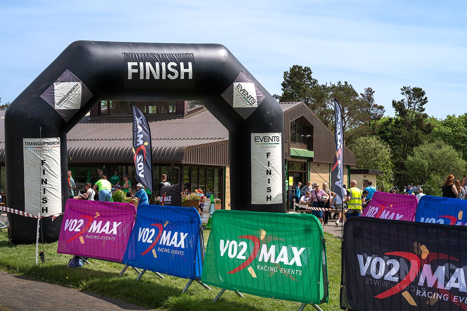 The finish line of the races at the event with company branding.