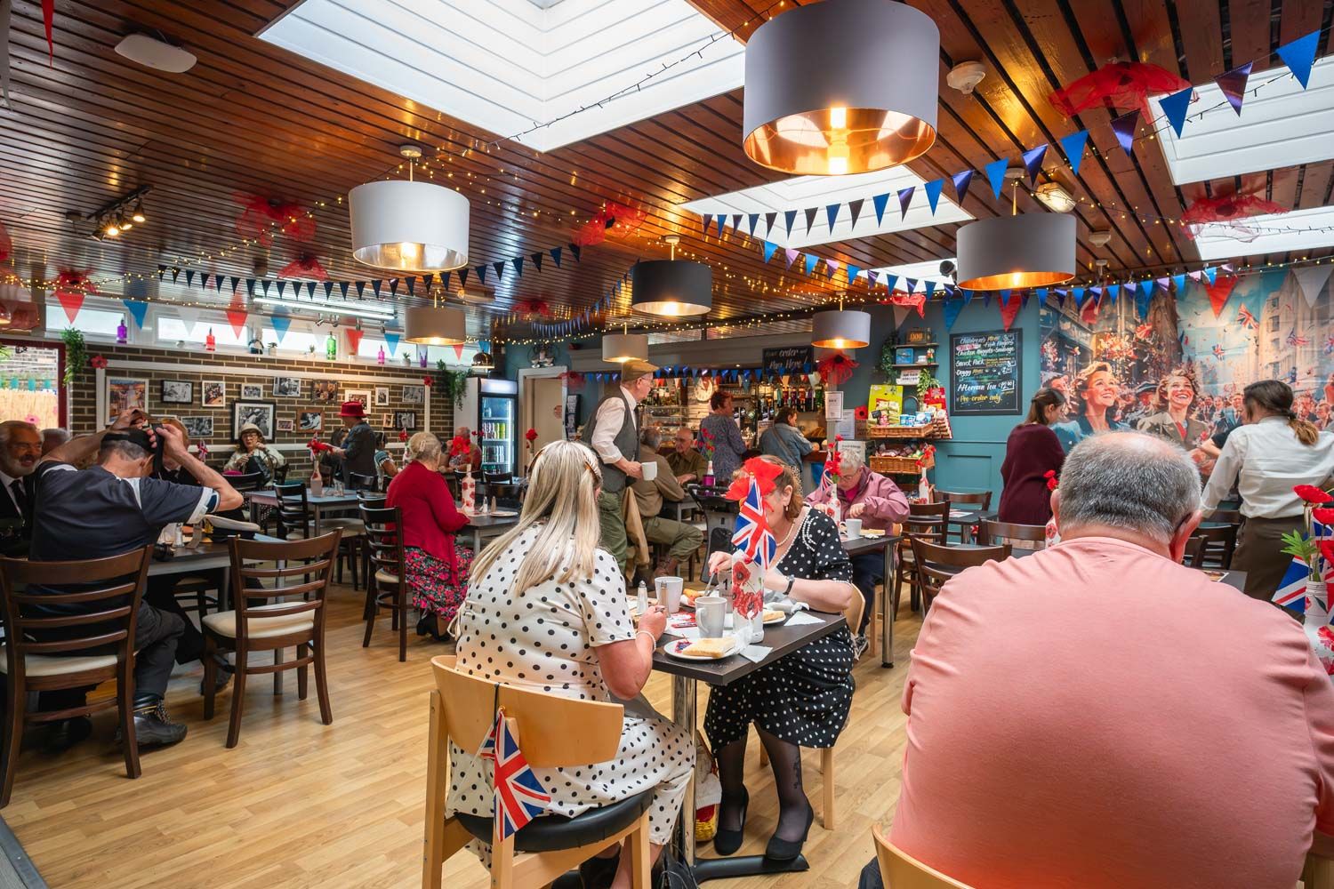 People gathering in a cafe at the Springwell event.