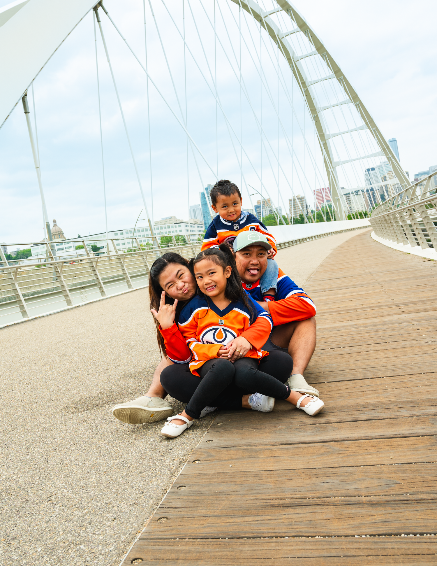 Family of four posing for an outdoor photography session in Edmonton.

relaxed goofy shot