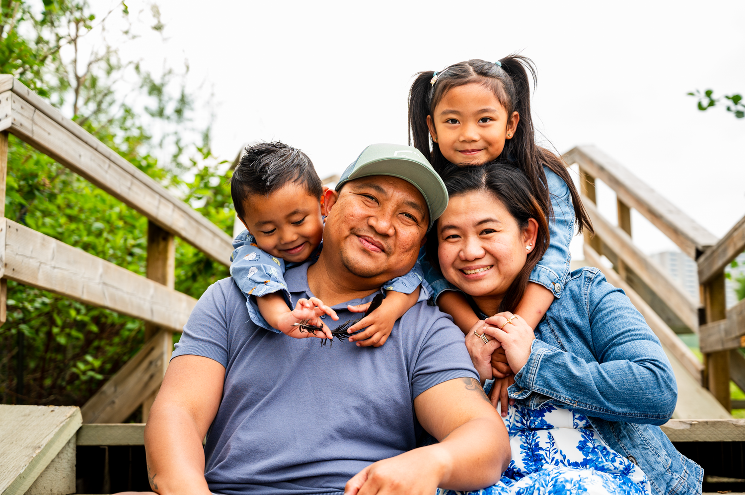 Family of four posing for an outdoor photography session in Edmonton.