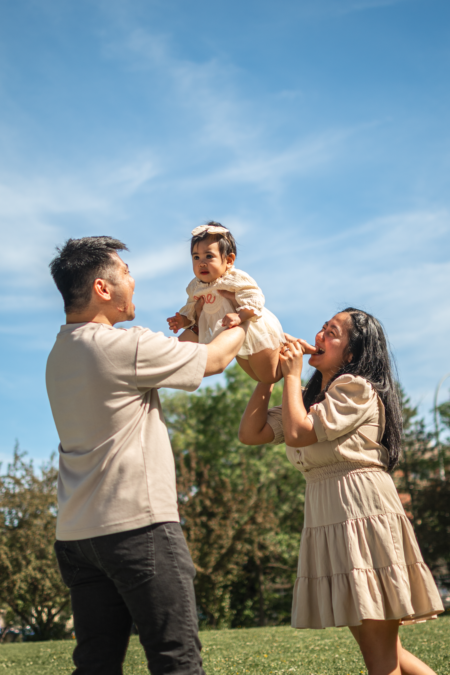 Parents playing with their newborn baby during a lifestyle session in Edmonton.

For the upcoming 1-year-old birthday