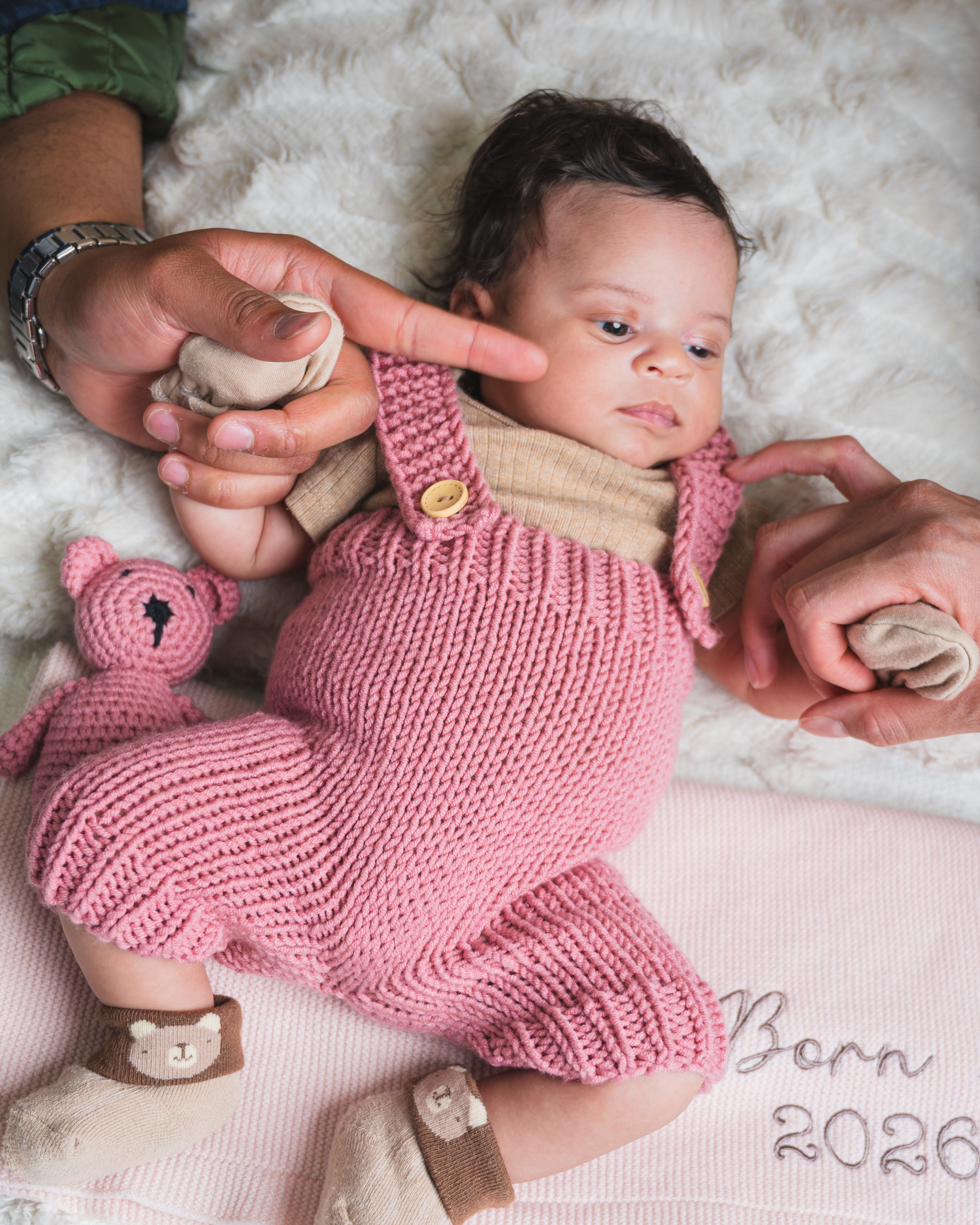 Parents holding their newborn baby during a lifestyle session in Edmonton.