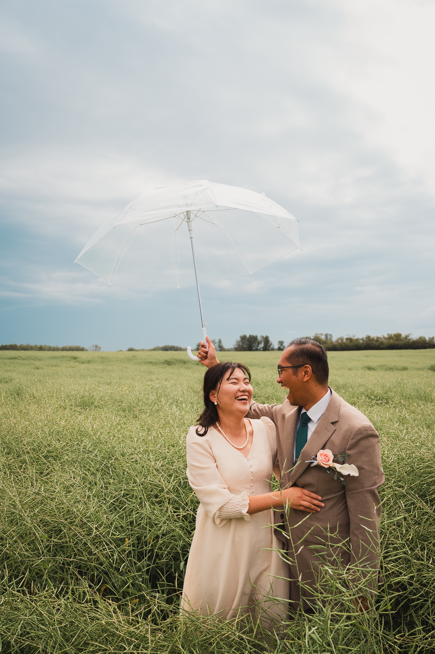 A couple posing after the wedding in Edmonton.

capturing a heartfelt laughter during the session