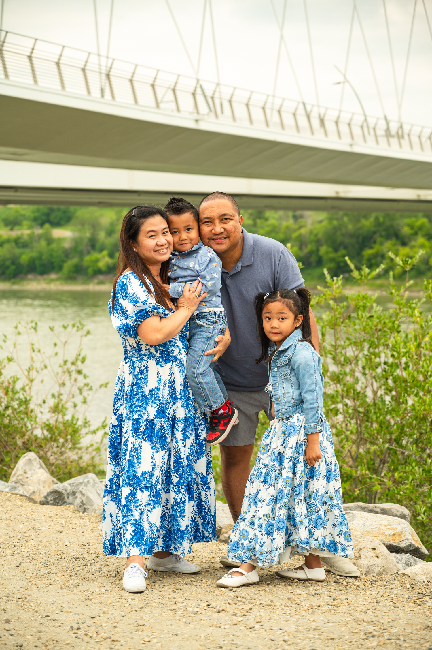 Family of four posing for an outdoor photography session in Edmonton.